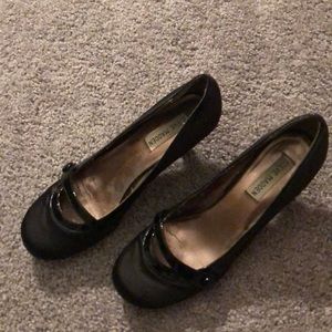 Black heels with attached front strap